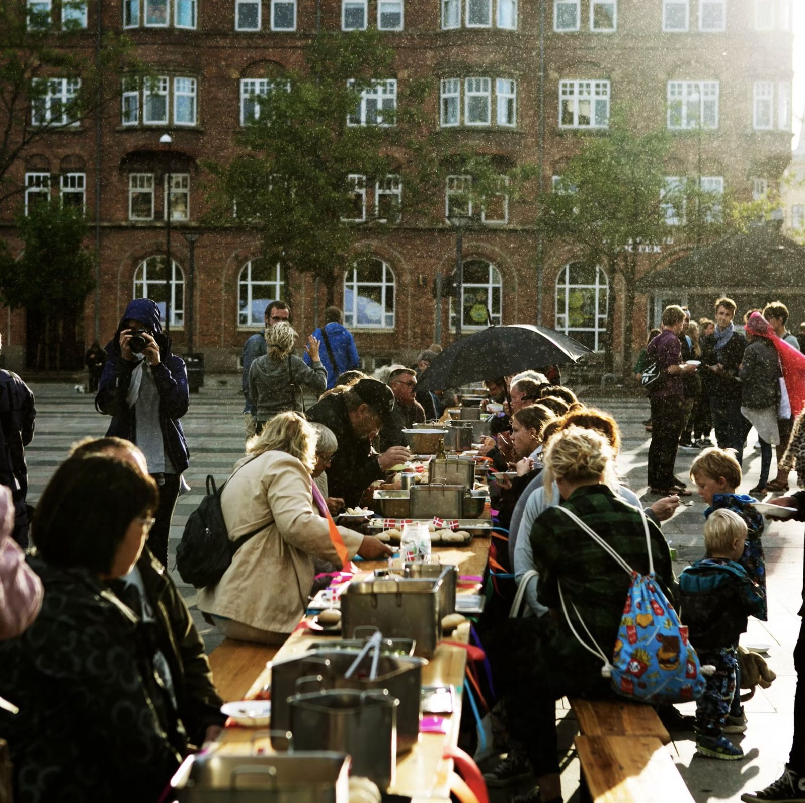 Babette’s Town Feast: the long table in a sunlit rain shower