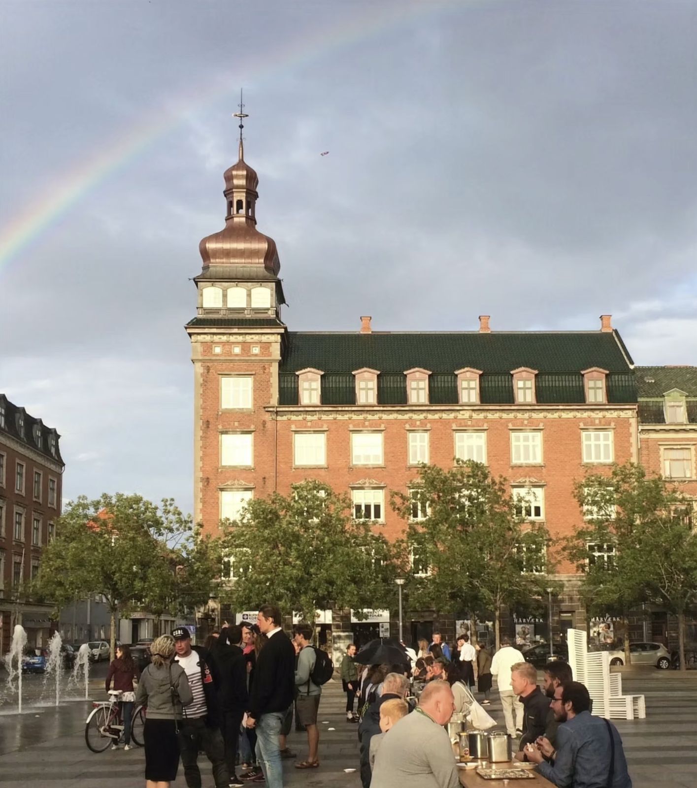 Babette’s Town Feast: a rainbow over the town square during the feast